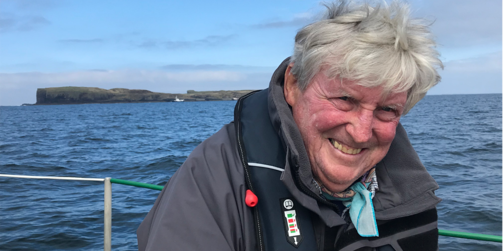 Longhorn Ian Dalziel, a professor at UT’s Department of Earth and Planetary Sciences, smiles for a photo on a boat