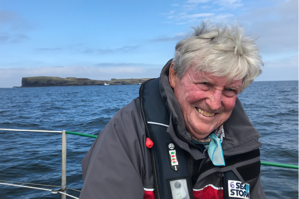 Longhorn Ian Dalziel, a professor at UT’s Department of Earth and Planetary Sciences, smiles for a photo on a boat