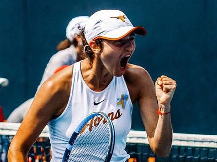 Zeynalova celebrates with her fist in the air on the tennis court