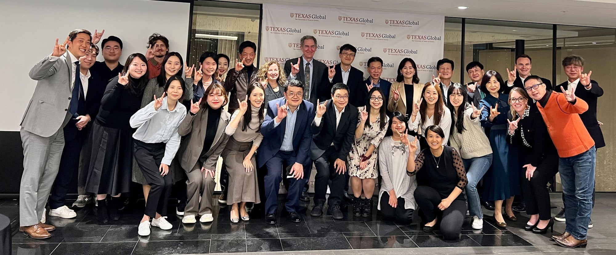 Sam Chi poses with the UT Korean Alumni group