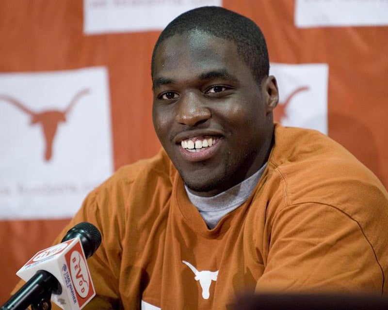 Sam Acho gives an interview at UT Austin after a game