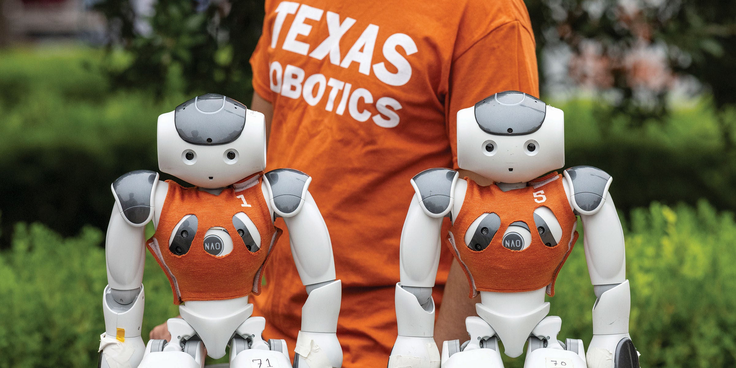 Sitting robots at the UT robotics parade in 2023