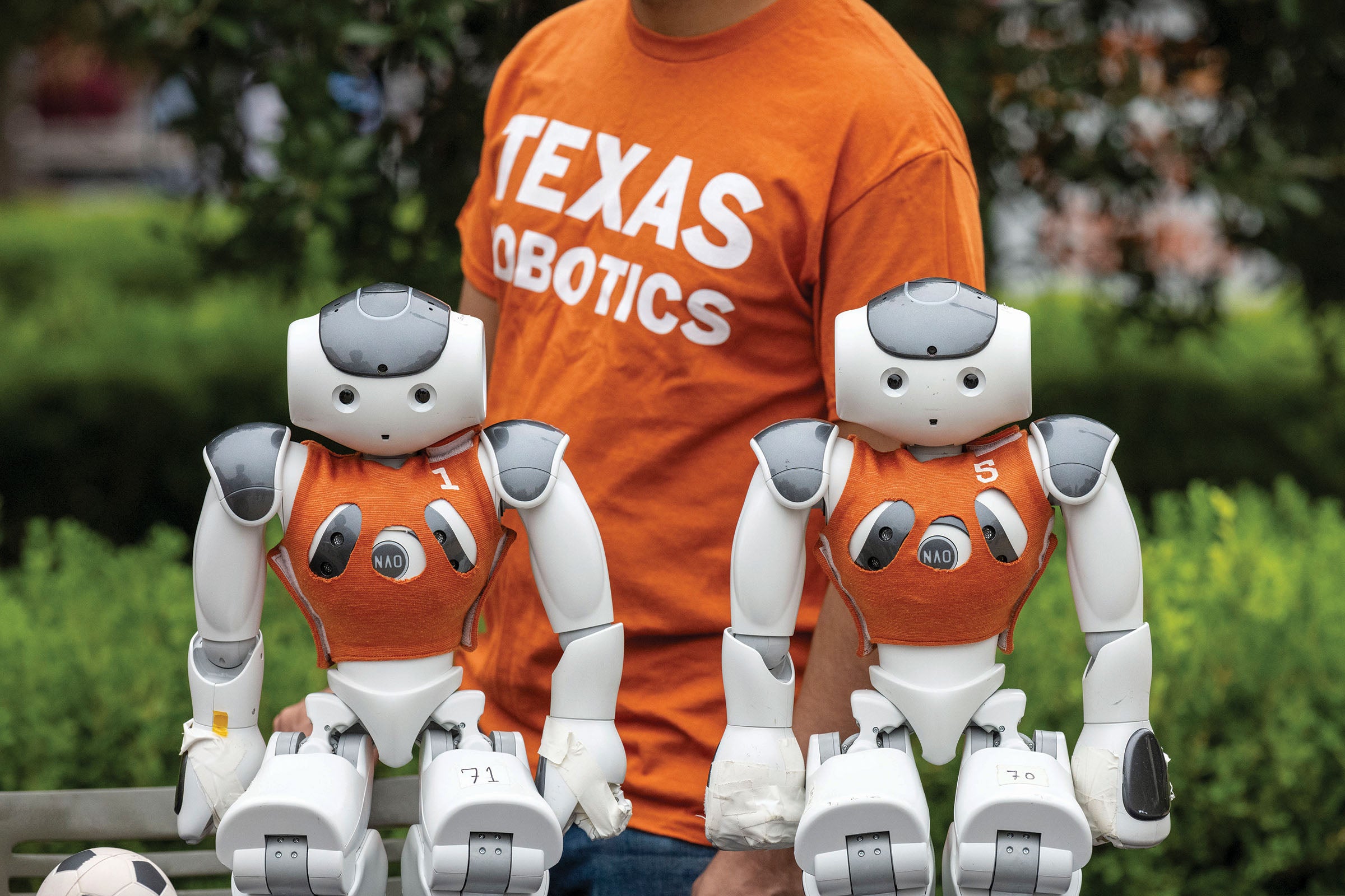 Sitting robots at the UT robotics parade in 2023